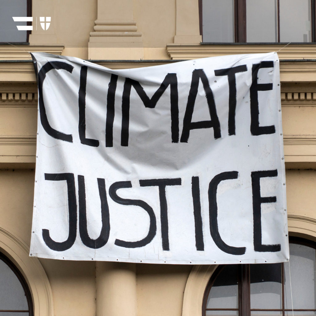 Titel: Klimagerechtigkeit Bild: "Climate Justice" auf einem Plakat